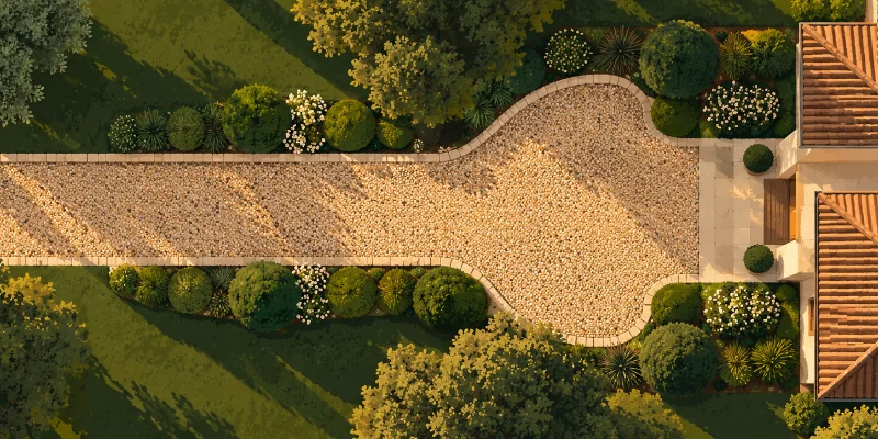 Freshly laid gravel driveway leading to a residential garage